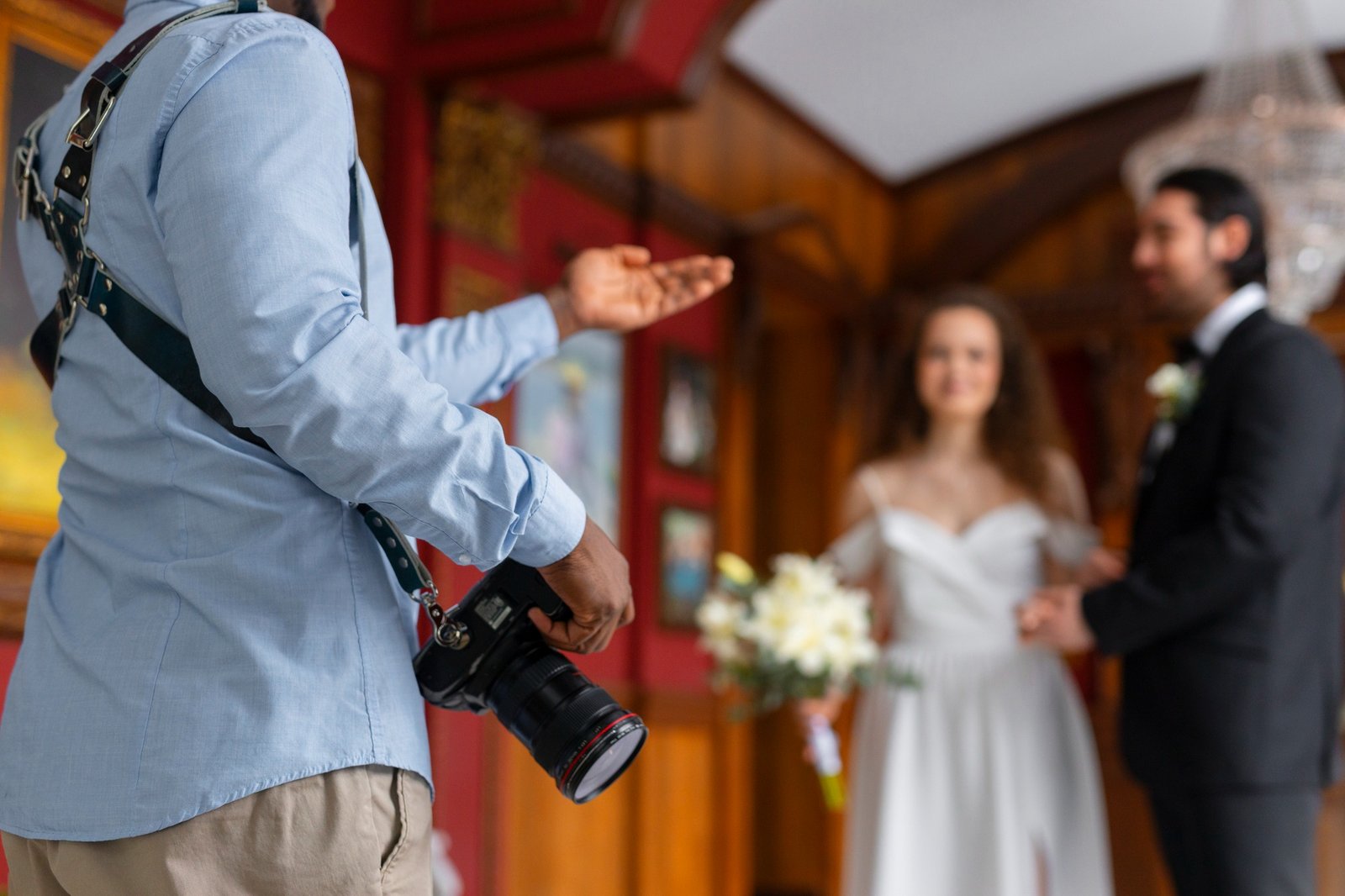 Wedding photographer directing a couple